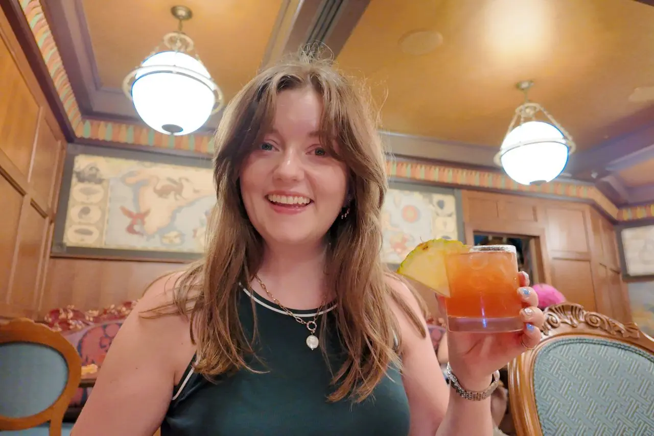 Chelsea with cocktail drink in Magic Kingdom Disney World