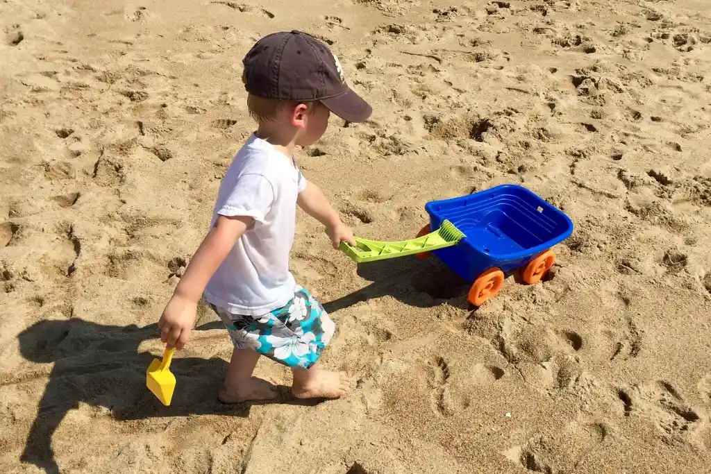 a kid on the beach