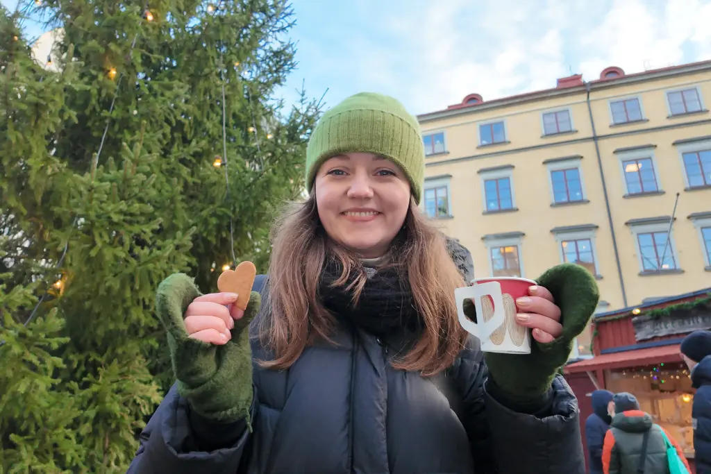 Chelsea with a mulled wine at Stockholm Christmas Market at Stortorget Gamla Stan Stockholm