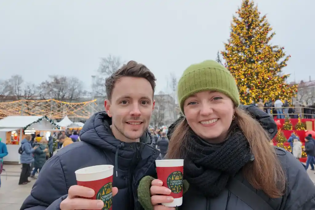 James and Chelsea with a mulled wine at Vilnius Christmas Market