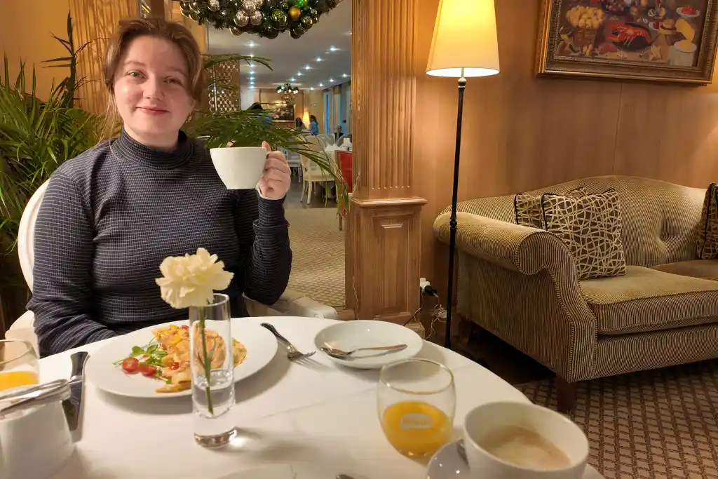 Chelsea having breakfast at Hotel Stikliai Vilnius