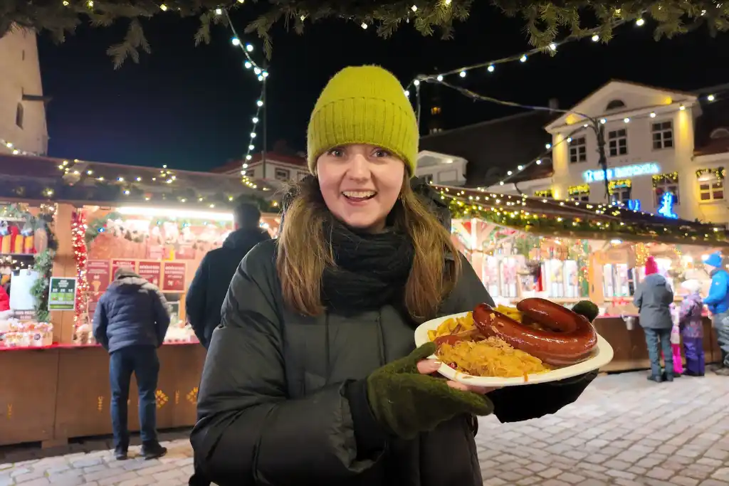 Chelsea with bratwurst at Tallinn Christmas Market