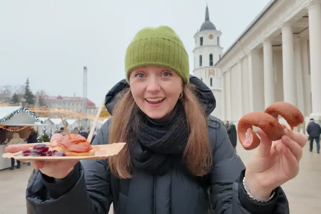 Chelsea with a sausage at Vilnius Christmas Market