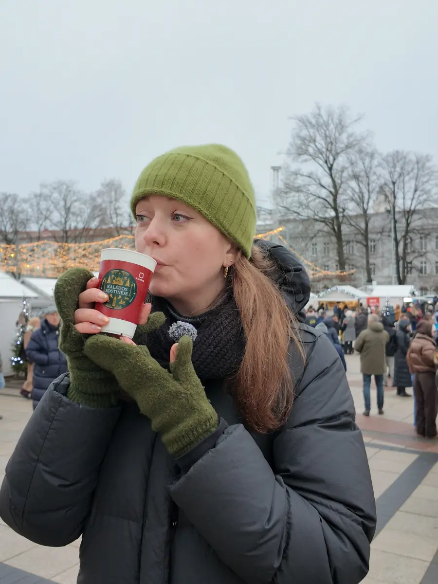 Chelsea with a mulled wine at Vilnius Christmas Market