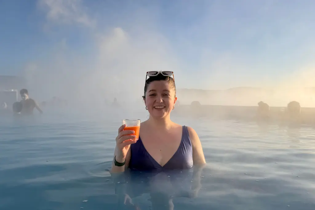 Chelsea with a drink in the Blue Lagoon Reykjavik Iceland