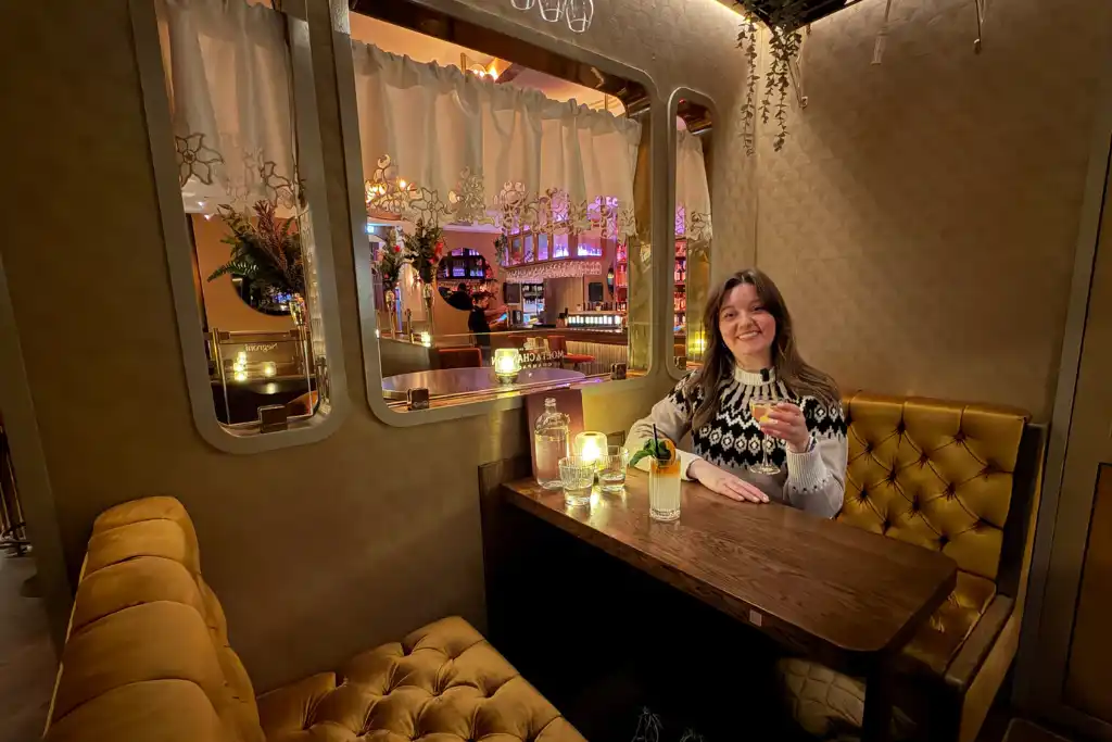 Chelsea in the champagne train carriage at Kokteilbarinn Reykjavik