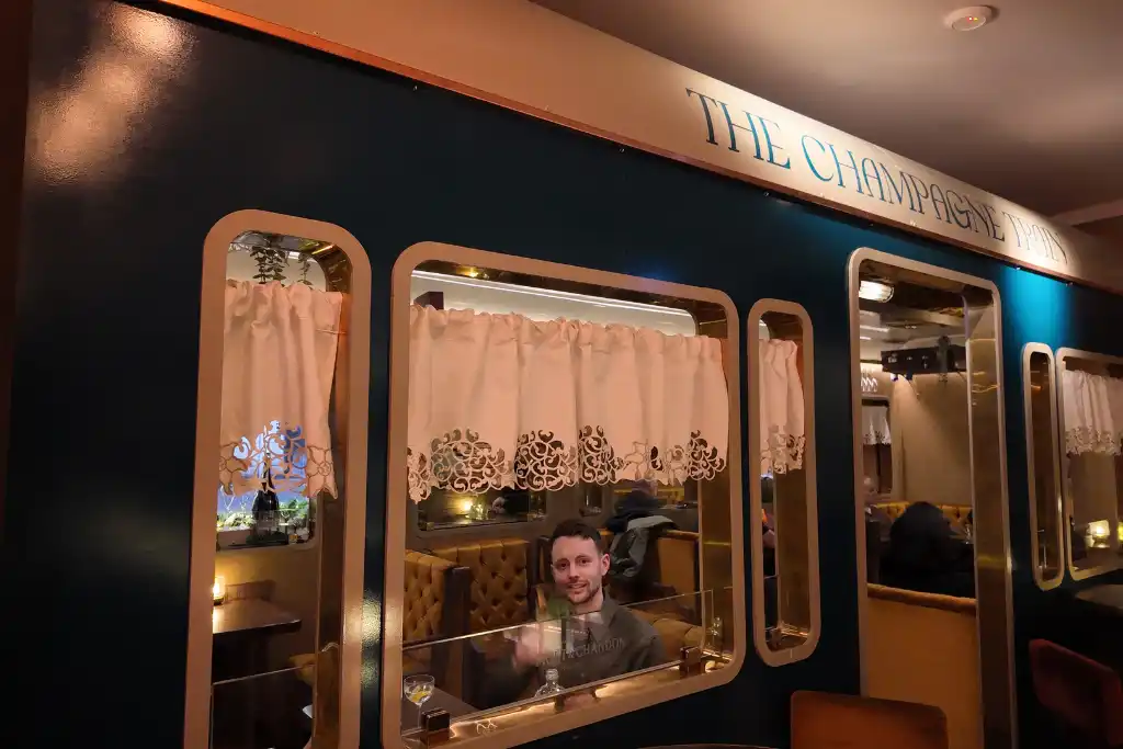 James in the train carriage at Kokteilbarinn Reykjavik